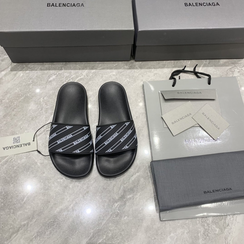 Ba*len*cia*ga black logo pool slides in grain rubber