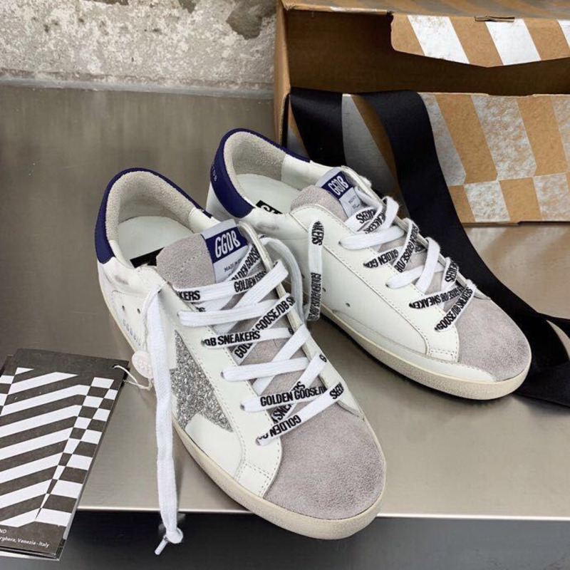 Golden Goose Men’s Super-Star Sneakers with Sliver Glitter Star and Blue Heel Tab