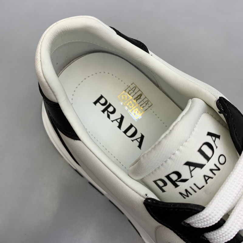 Pra*a logo leather sneakers black & white