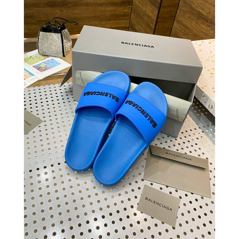 Ba*len*cia*ga pool slide sandal in blue smooth rubber with black 3d Ba*len*cia*ga logo