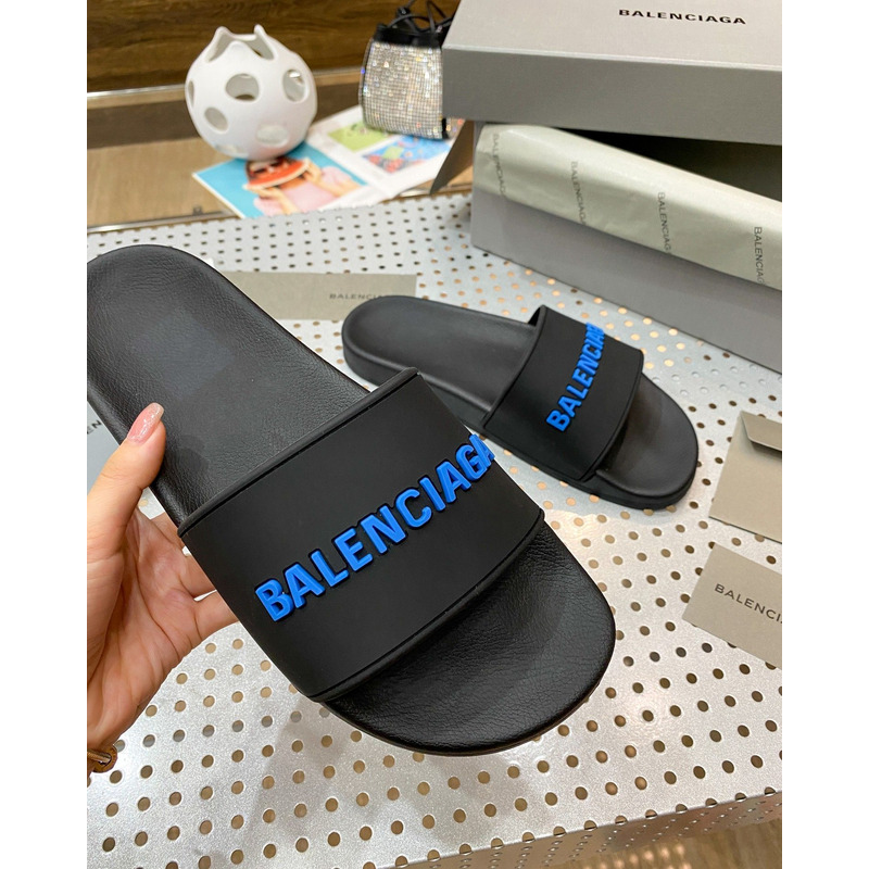 Ba*len*cia*ga pool slide sandal in black rubber with blue 3d Ba*len*cia*ga logo