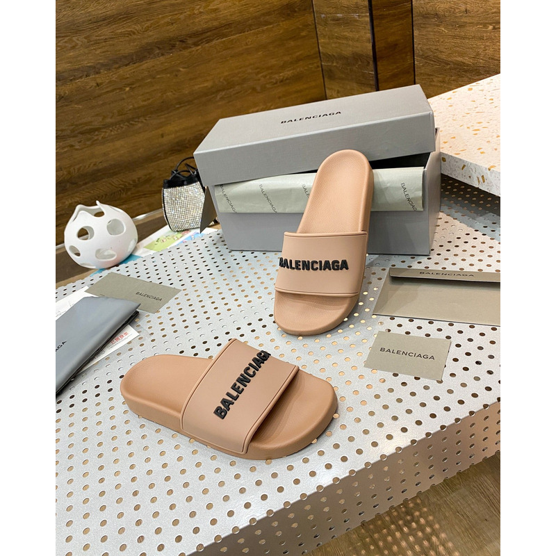 Ba*len*cia*ga pool slide sandal in beige smooth rubber with black 3d Ba*len*cia*ga logo