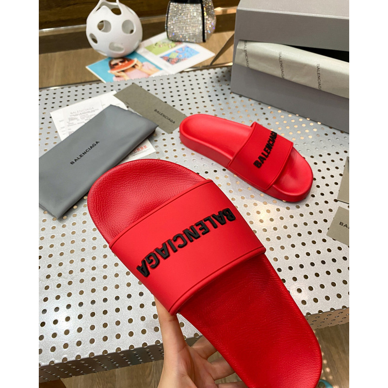 Ba*len*cia*ga pool slide sandal in red smooth rubber with black 3d Ba*len*cia*ga logo