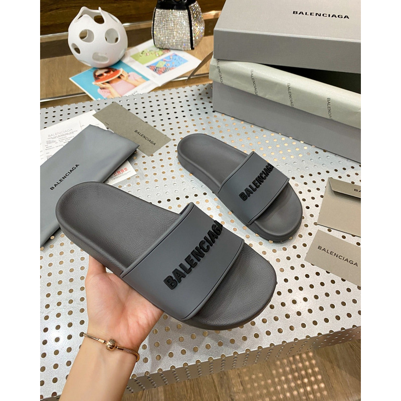 Ba*len*cia*ga pool slide sandal in grey rubber with black 3d Ba*len*cia*ga logo