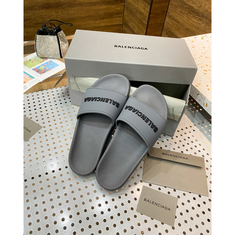 Ba*len*cia*ga pool slide sandal in grey rubber with black 3d Ba*len*cia*ga logo