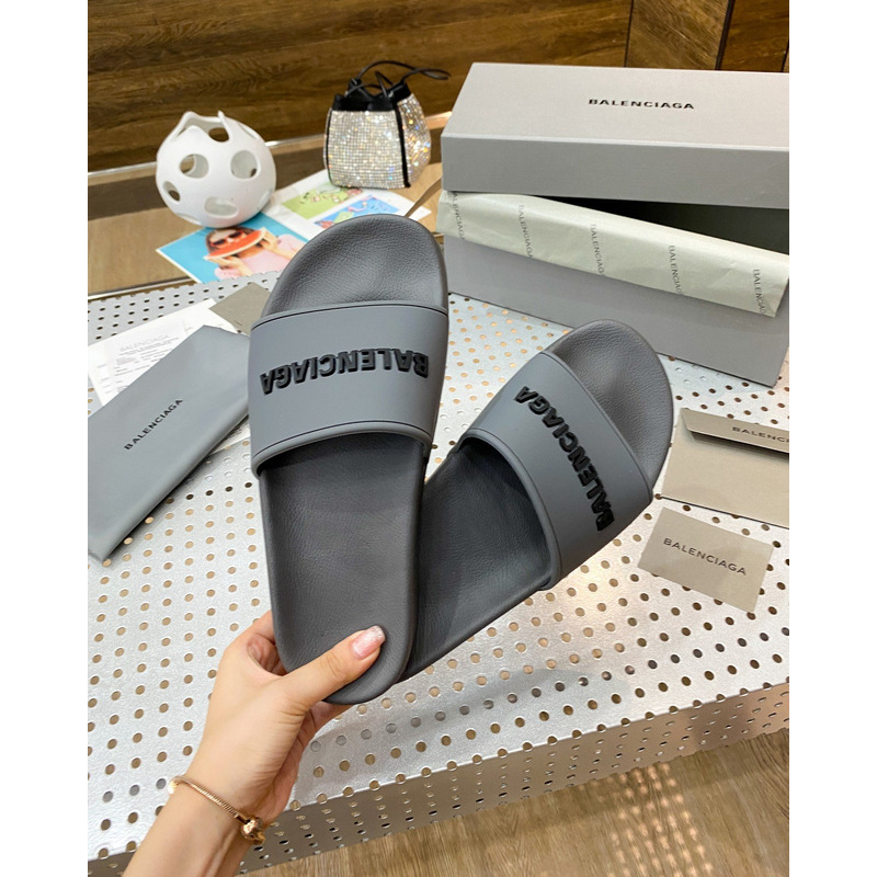 Ba*len*cia*ga pool slide sandal in grey rubber with black 3d Ba*len*cia*ga logo