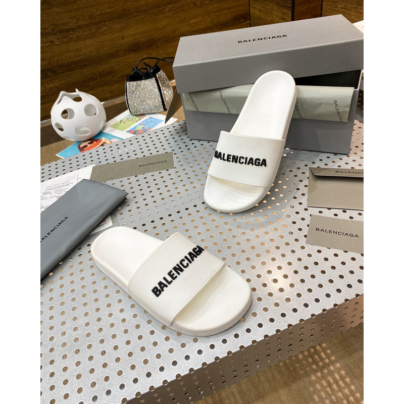 Ba*len*cia*ga pool slide sandal in eggshell white smooth rubber with black 3d Ba*len*cia*ga logo