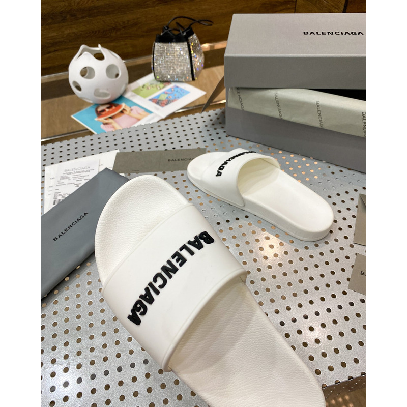 Ba*len*cia*ga pool slide sandal in eggshell white smooth rubber with black 3d Ba*len*cia*ga logo