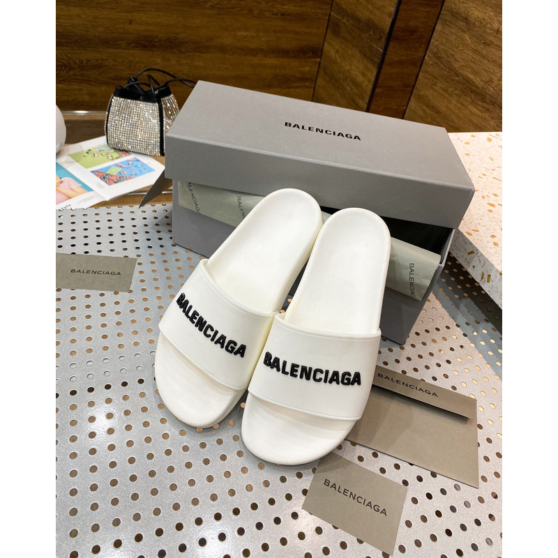 Ba*len*cia*ga pool slide sandal in eggshell white smooth rubber with black 3d Ba*len*cia*ga logo