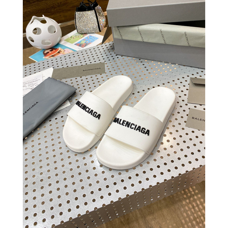 Ba*len*cia*ga pool slide sandal in eggshell white smooth rubber with black 3d Ba*len*cia*ga logo