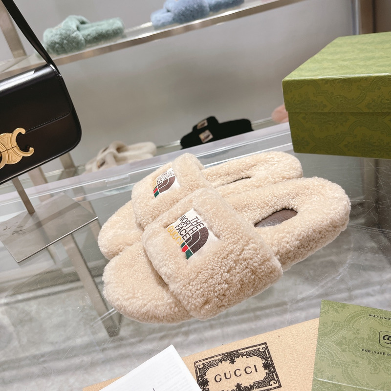 G*u*i x the north face shearling slides beige