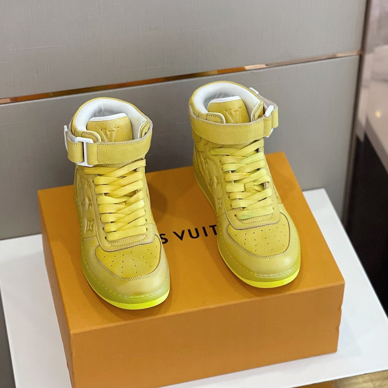 l**is V*t*n embossed monogram high-top sneaker gold