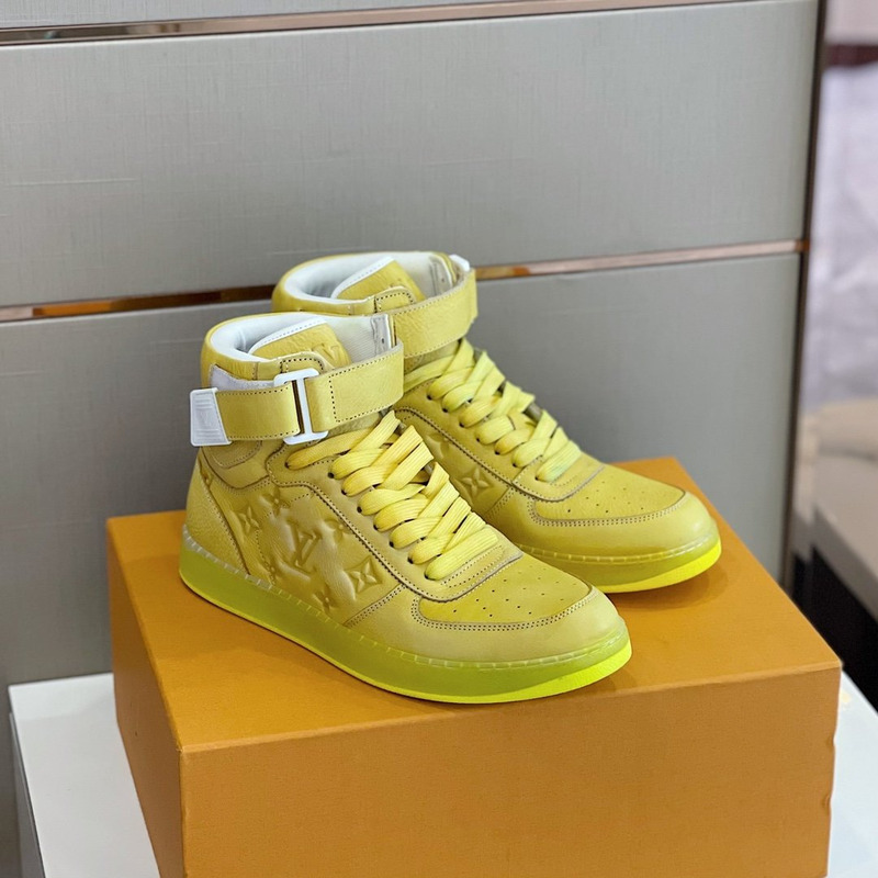 l**is V*t*n embossed monogram high-top sneaker gold