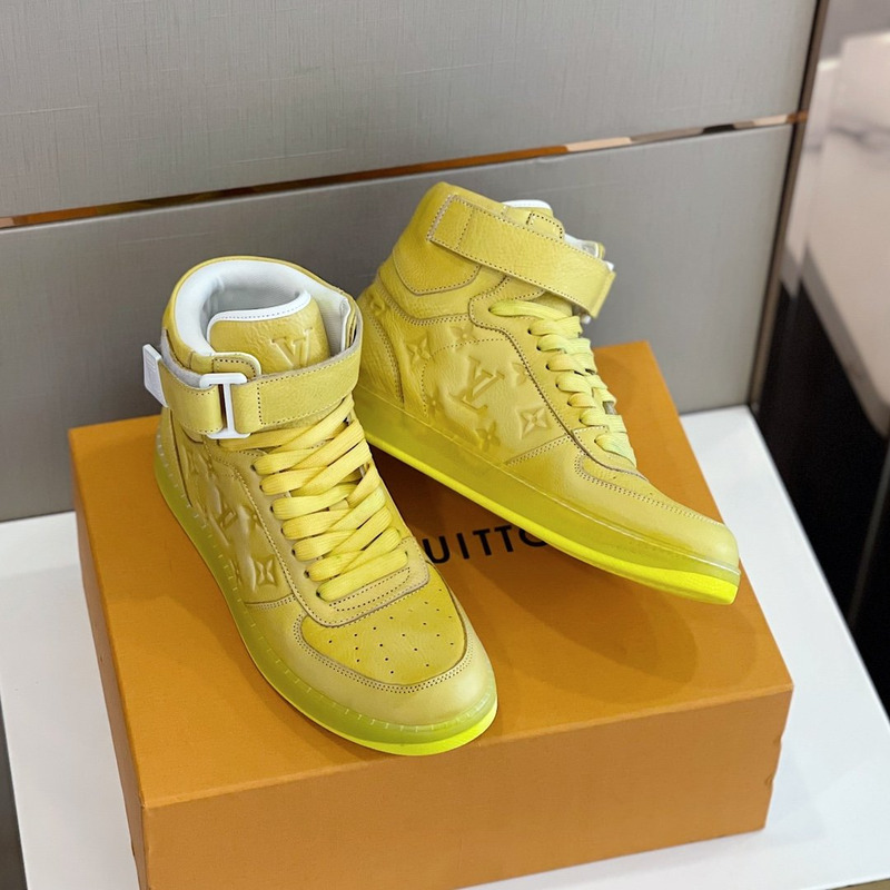 l**is V*t*n embossed monogram high-top sneaker gold