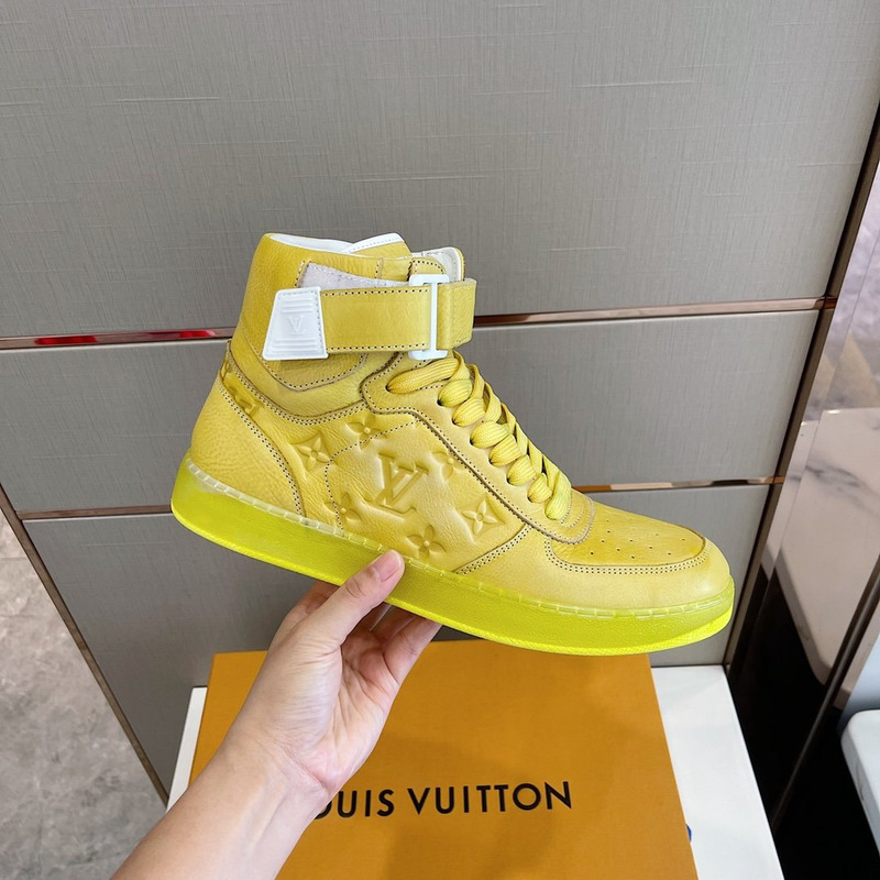 l**is V*t*n embossed monogram high-top sneaker gold