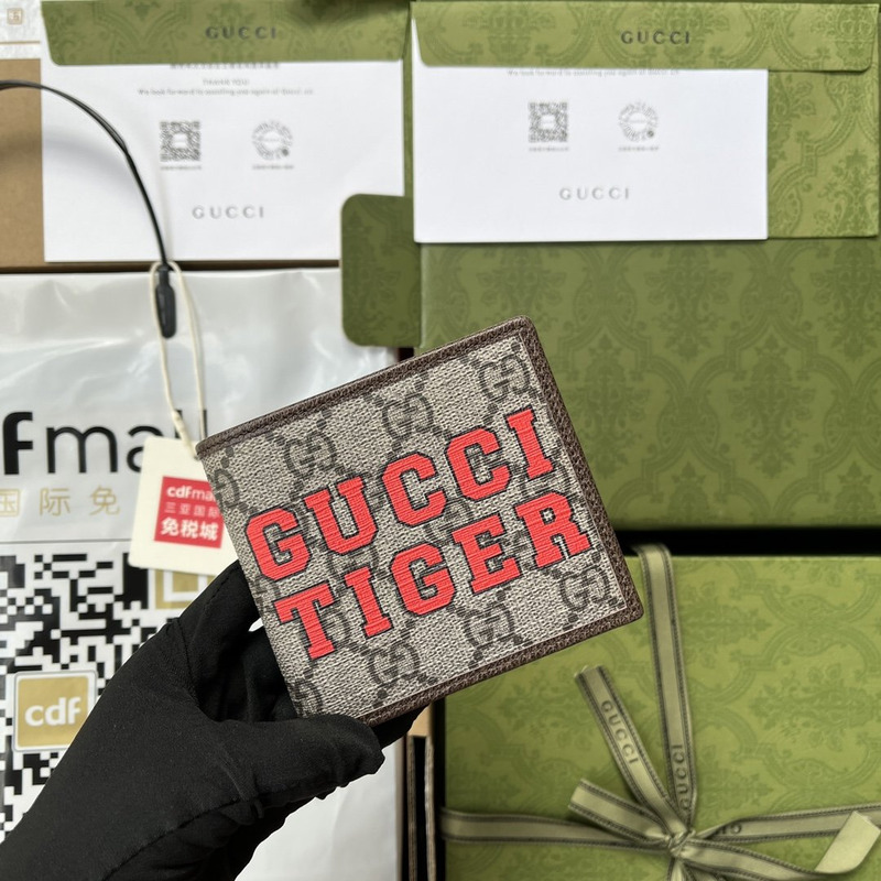 G*u*i tiger print wallet