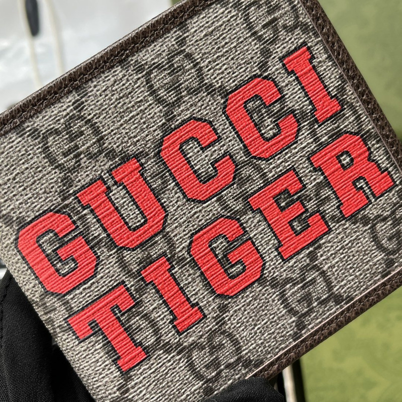 G*u*i tiger print wallet