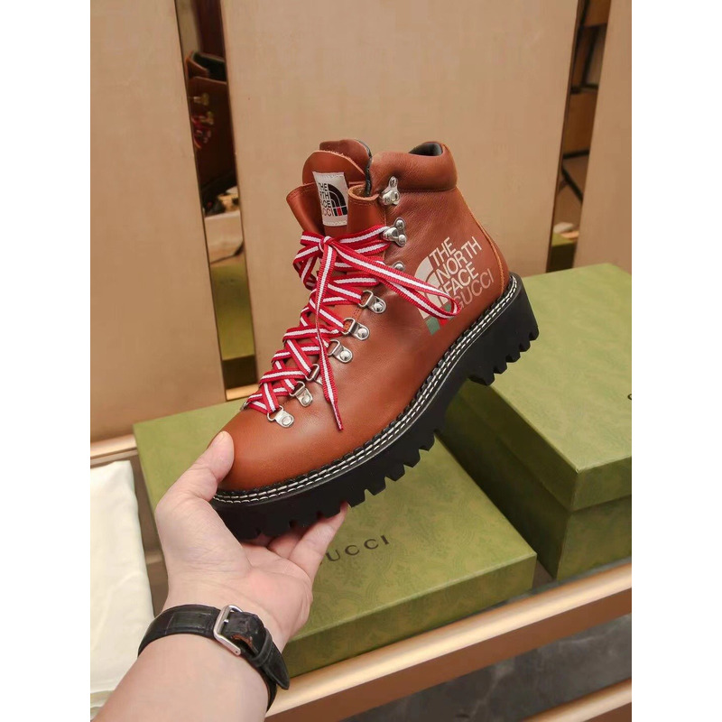 G*u*i x the north face leather ankle boots brown