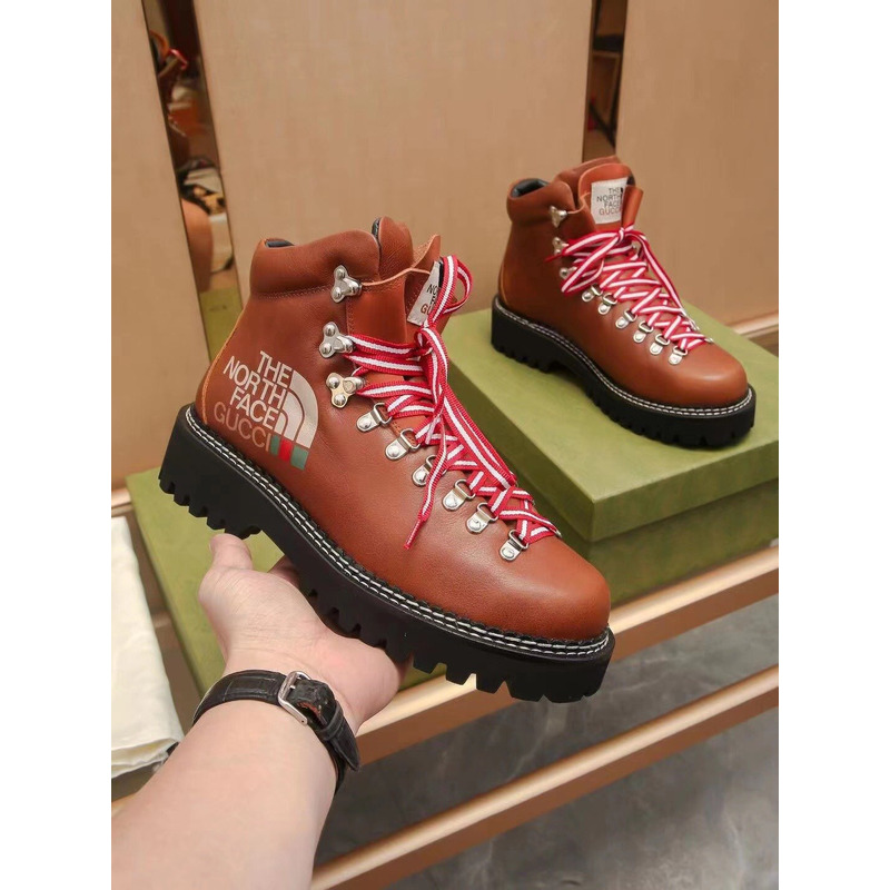 G*u*i x the north face leather ankle boots brown