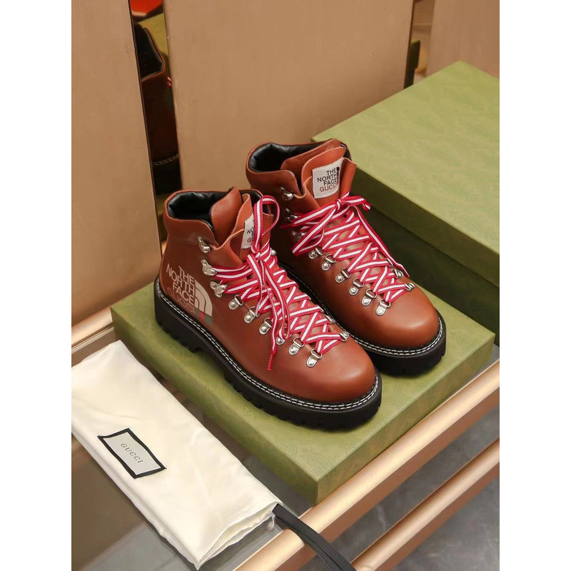 G*u*i x the north face leather ankle boots brown