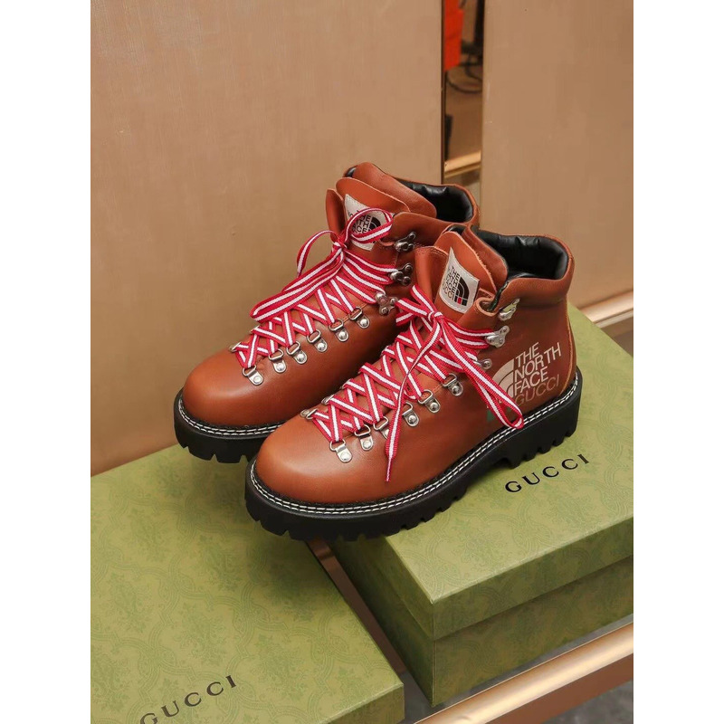 G*u*i x the north face leather ankle boots brown