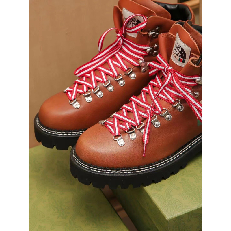 G*u*i x the north face leather ankle boots brown