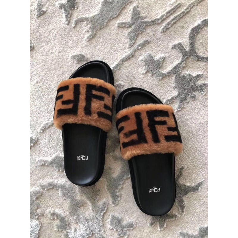 F**di brown leather and wool slide