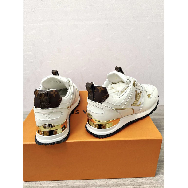 l**is V*t*n run away leather trainers white and gold