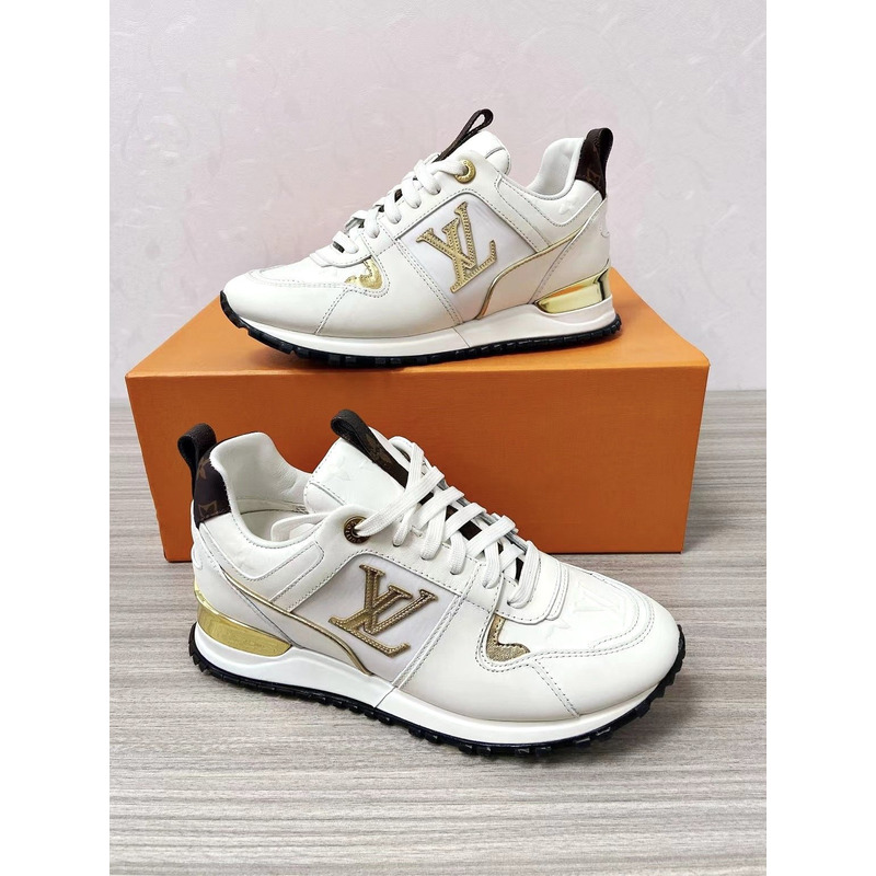 l**is V*t*n run away leather trainers white and gold