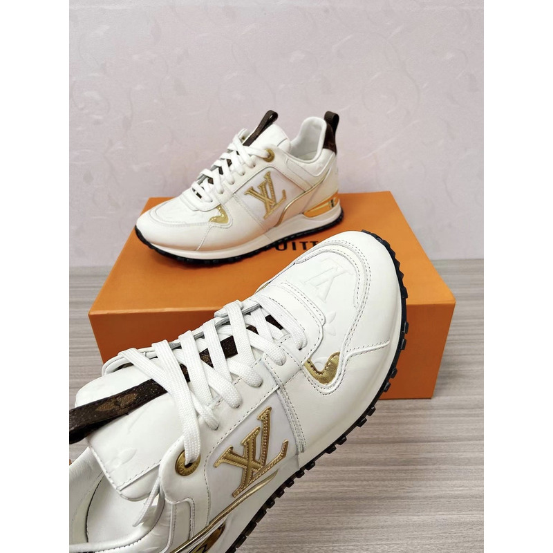 l**is V*t*n run away leather trainers white and gold