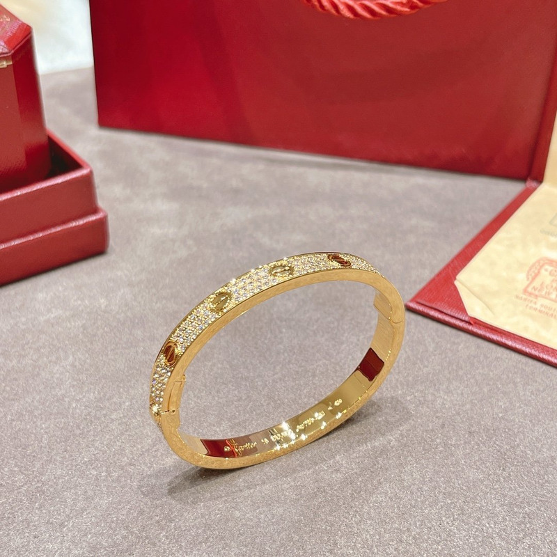 CARTIER DIAMOND PAVED LOVE BANGLE BRACELET IN YELLOW GOLD