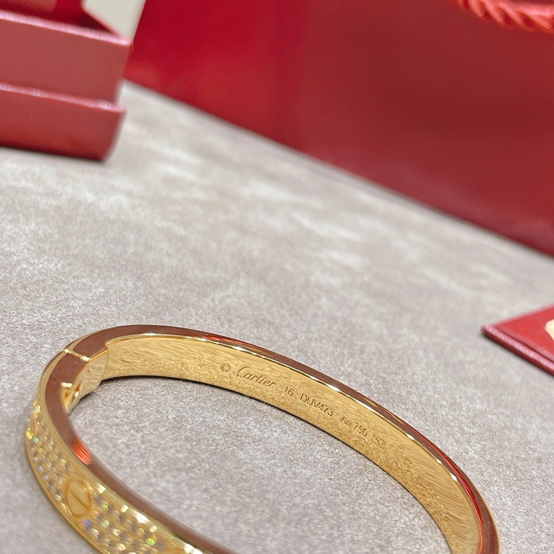 CARTIER DIAMOND PAVED LOVE BANGLE BRACELET IN YELLOW GOLD