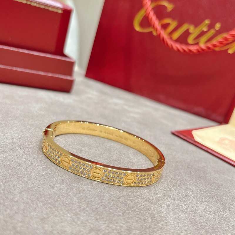 CARTIER DIAMOND PAVED LOVE BANGLE BRACELET IN YELLOW GOLD