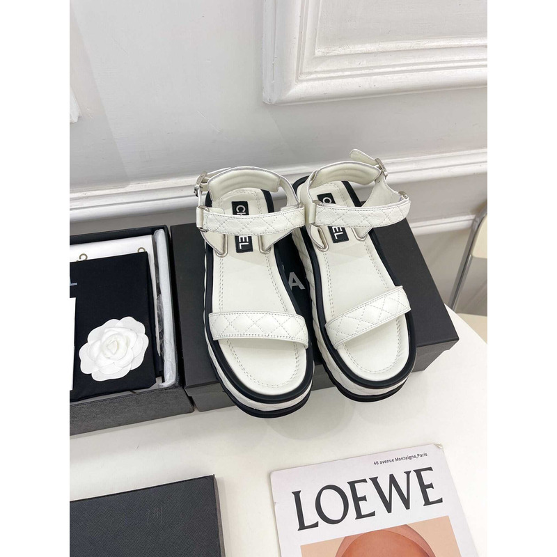 Ch*el black leather sandals in white