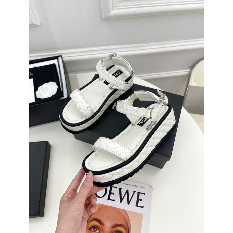 Ch*el black leather sandals in white