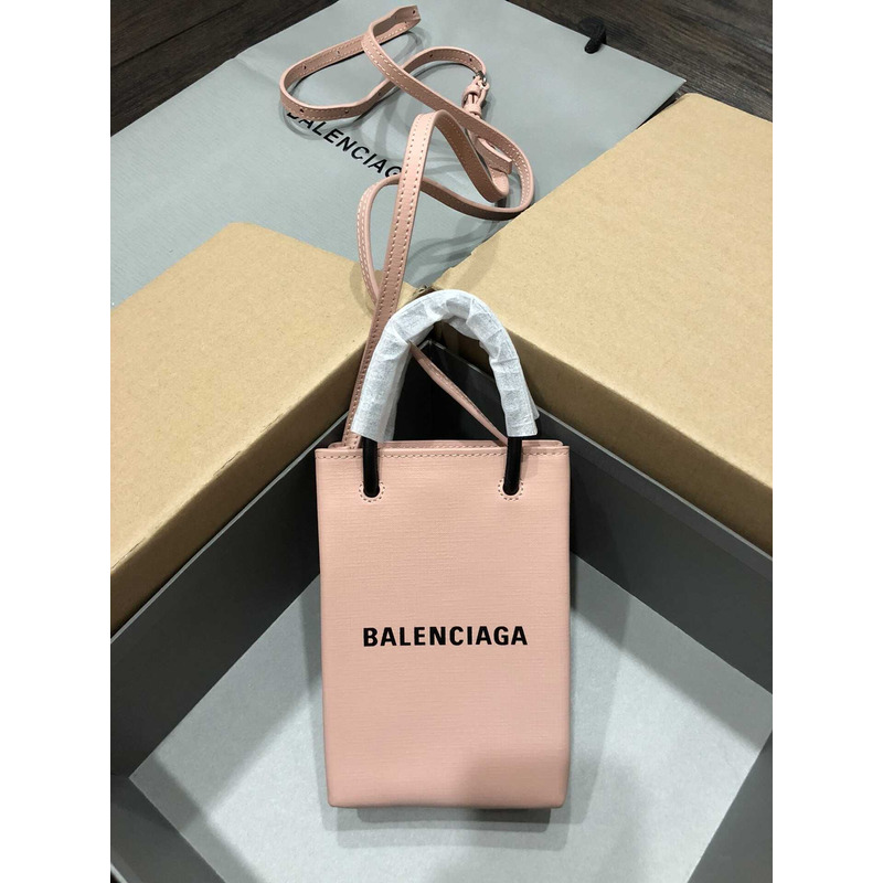 Ba*len*cia*ga textured calfskin logo shopping phone holder bag nude pink