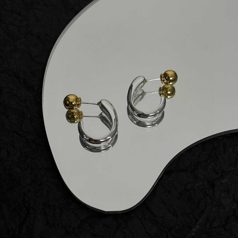 Ce**e earrings in brass silver