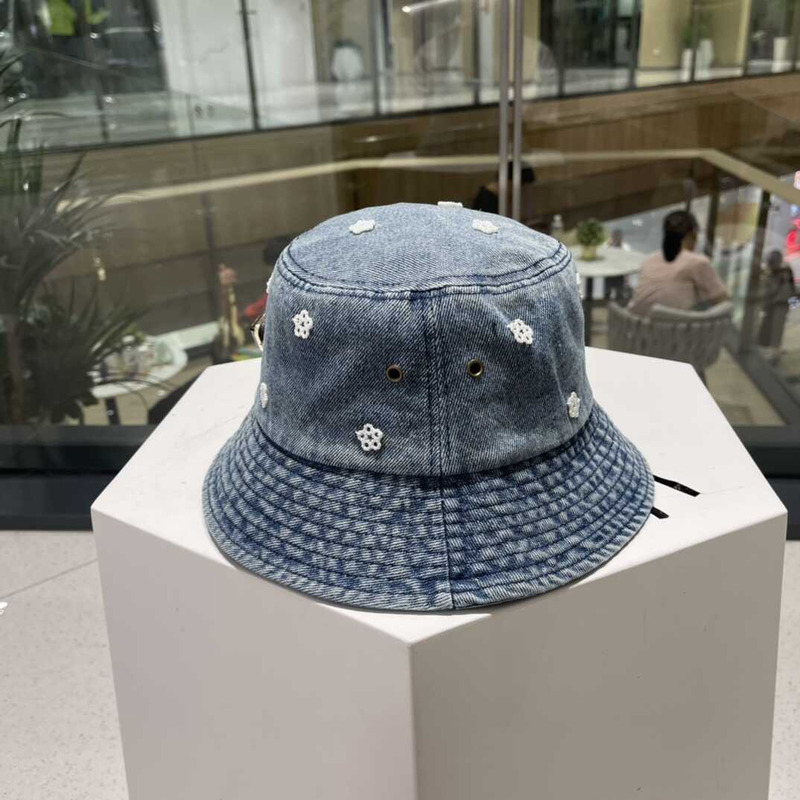 Pra*a denim bucket hat with daisy light blue