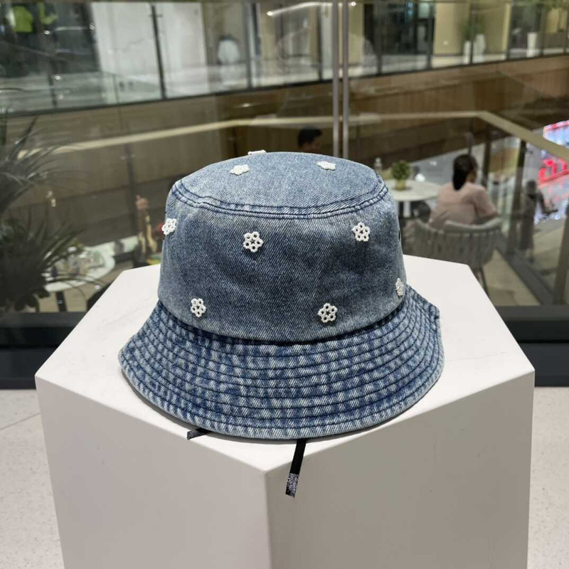 Pra*a denim bucket hat with daisy light blue