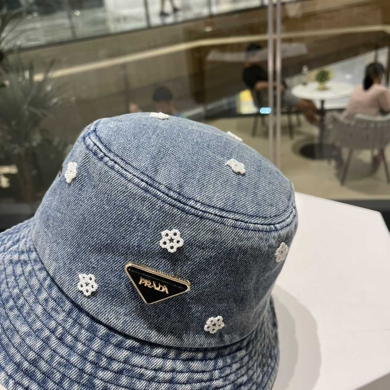 Pra*a denim bucket hat with daisy light blue