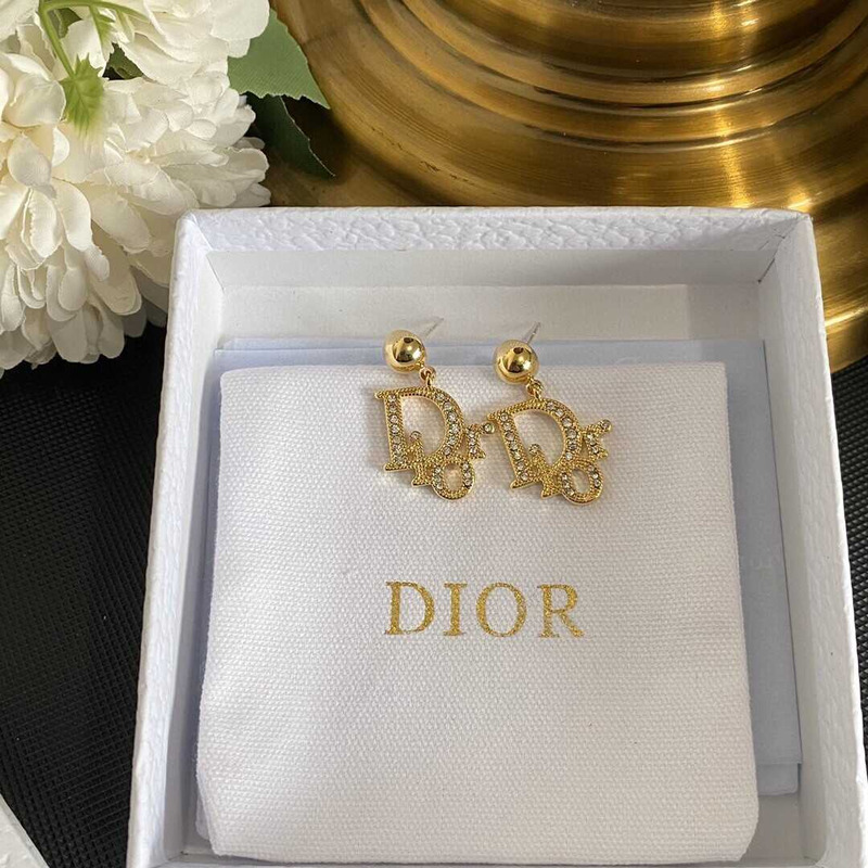 D*or gold letter stud earrings