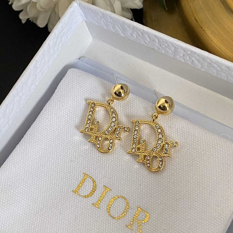 D*or gold letter stud earrings