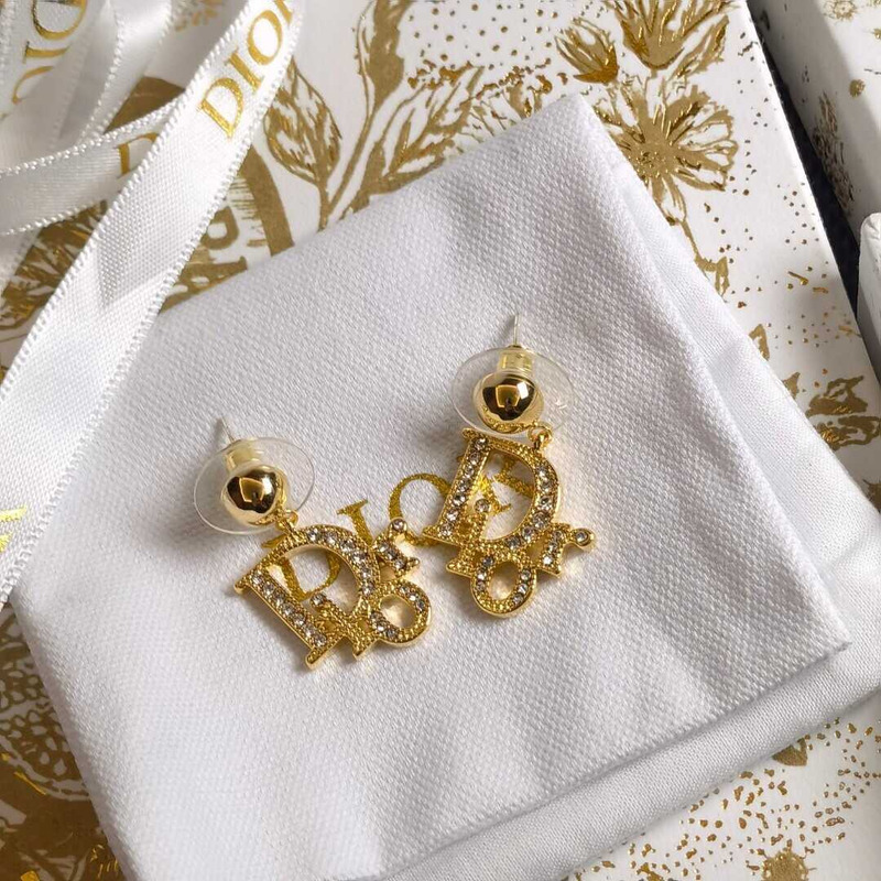 D*or gold letter stud earrings