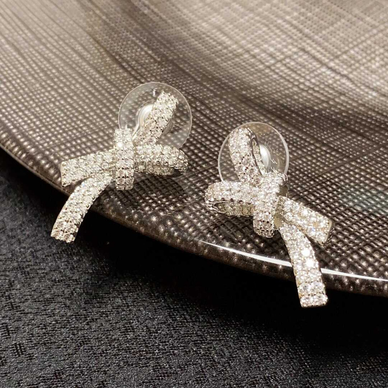 Ch*el bow tie sparkling diamond earrings