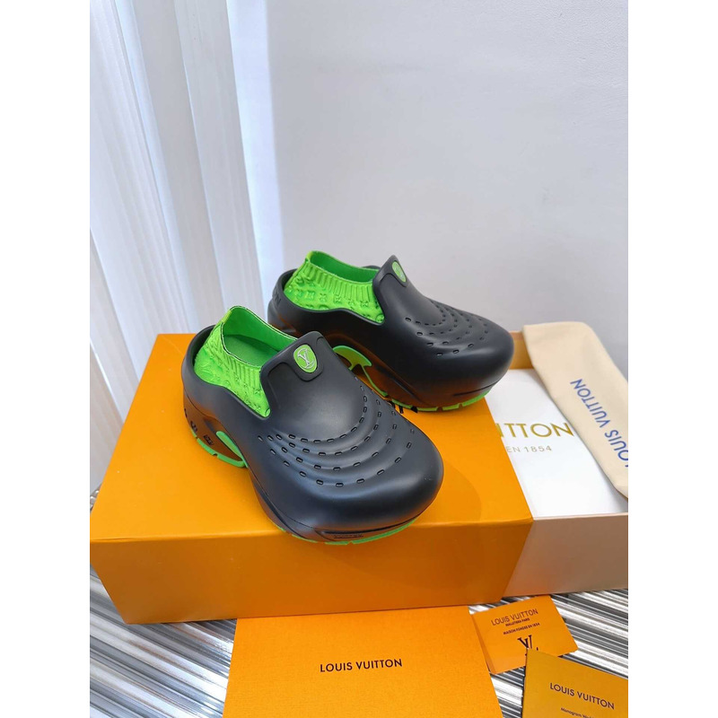 l**is V*t*n foam clogs green and black