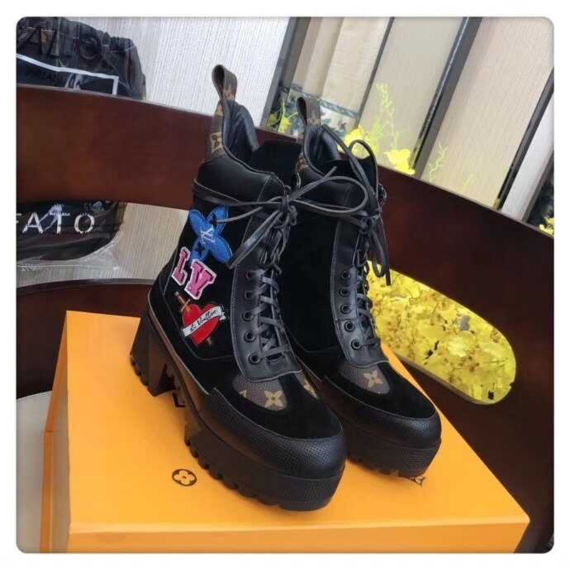 l**is V*t*n laureate platform desert boots with cartoon logo