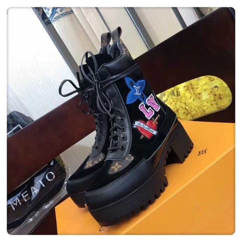 l**is V*t*n laureate platform desert boots with cartoon logo