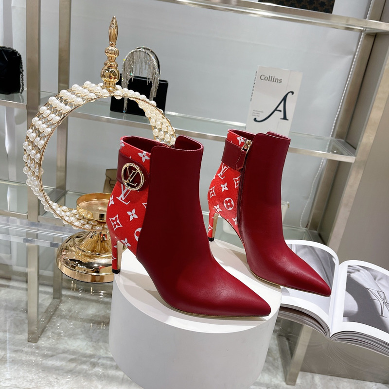 l**is V*t*n ankle heels with logo red