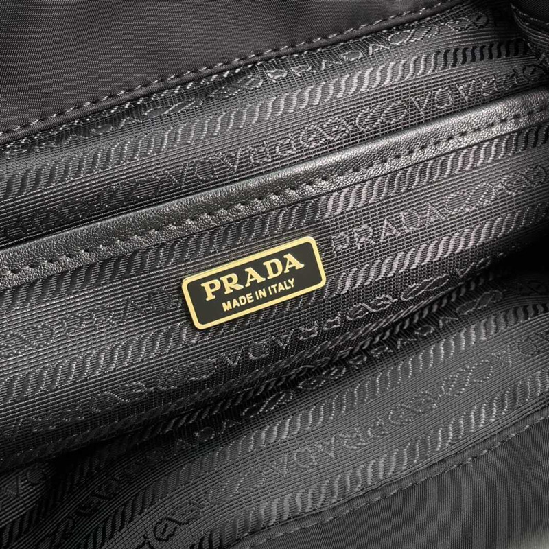 Pra*a medium re-nylon and brushed leather backpack black