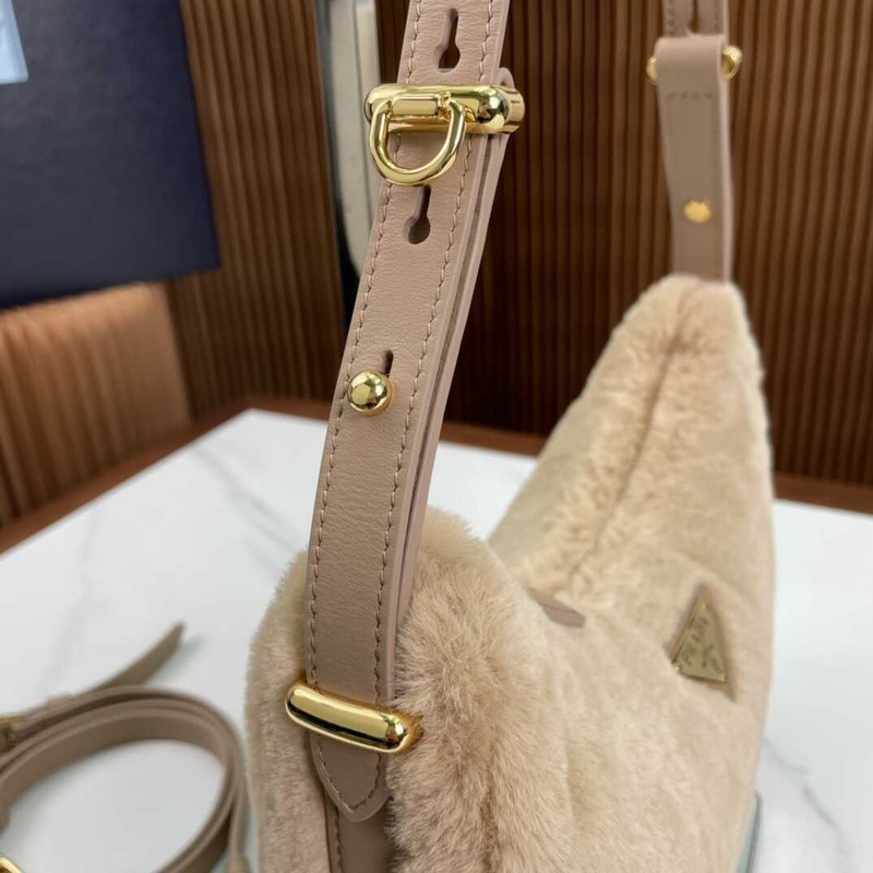 Pra*a arqué shearling and leather shoulder bag beige